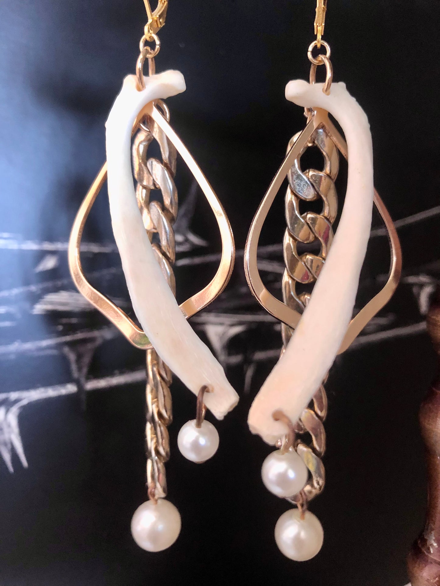 Rib, Pearl, and chain earrings
